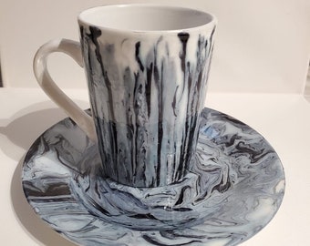 poured acrylic paint on mug and plate