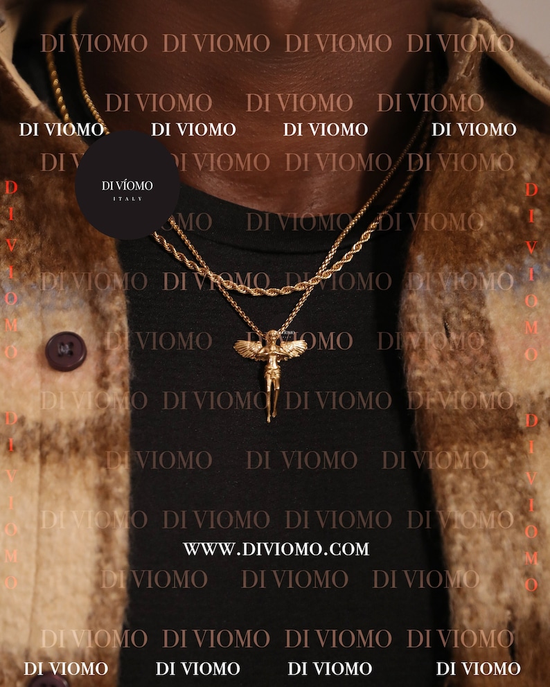 May include: A black t-shirt with the text "DI VIOMO ITALY" repeated in a pattern. The shirt is worn by a person with a gold chain necklace featuring a winged angel pendant. The text "WWW.DIVIOMO.COM" is visible at the bottom of the image.