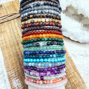 May include: A rustic wooden sign with the text "Welcome to our home" in white lettering. The sign features a distressed finish and a simple, inviting design, perfect for a front porch or entryway.