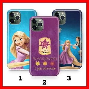 May include: Three different phone cases featuring a purple, blue, and light blue background with a cartoon image of Rapunzel and Flynn Rider from the Disney movie Tangled. The purple case has the text "You were my new dream & you were mine" and a stylized image of a lantern with a sun inside.