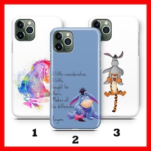 May include: Three phone cases featuring Disney characters. One case has a watercolour image of Eeyore. Another case is light blue with Eeyore and a quote. The third case has Tigger and Eeyore. All cases are white.