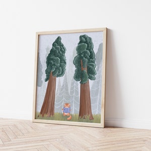 May include: A framed illustration of two large trees with a small orange cat wearing a blue sweater standing in front of them. The trees are brown with green foliage and the background is a light gray.