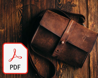 May include: A brown leather crossbody bag with a strap and a flap closure. The bag has a white stitching detail and a small logo on the front.