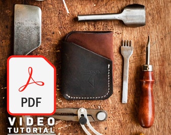 May include: A leather wallet with a brown and black color scheme. The wallet has a flap and a stitched edge. The image also shows various leatherworking tools, including a stitching awl, a stitching pony, and a leather punch. The image includes the text "VIDEO TUTORIAL" and "PDF".