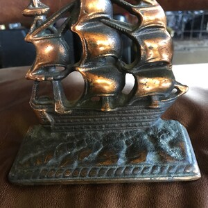 A set of 2 Antique Old Ironsides Iron/Copper Finish Book ends