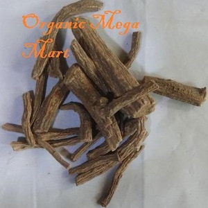 May include: A pile of dried, brown, woody roots. The text "Organic Mega Mart" is written in orange script across the top of the image. The roots appear to be of varying lengths and thicknesses, with a rough, textured surface.