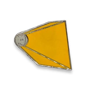 May include: A yellow enamel pin shaped like a diamond with a silver outline. The pin has a small silver circle at the top.