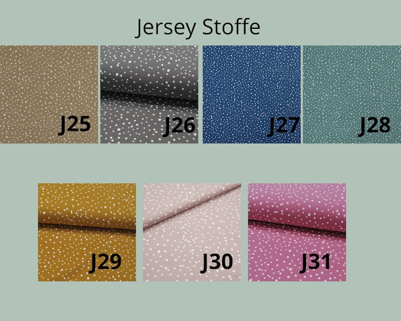 May include: A collection of seven jersey fabric swatches labeled J25 through J31, each featuring a white speckled pattern on solid backgrounds of tan, gray, blue, teal, mustard yellow, light pink, and magenta. The text Jersey Stoffe is visible.