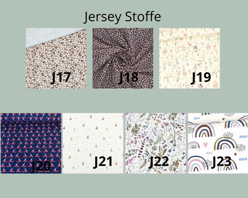 K&ouml;nnte beinhalten: Eine Sammlung von sieben Jersey-Stoffmustern, beschriftet von J17 bis J23. Die Muster umfassen braunen Leopardenprint, schwarzen Leopardenprint, kleine Blumen, marineblau mit rosa Segelbooten, wei&szlig;e Segelboote, botanische Wildblumen und Regenbogenmotive.
