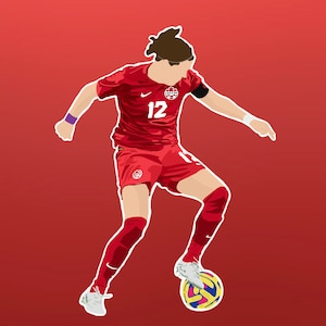May include: A football player wearing a red jersey with the number 12 and the Canadian flag on the chest, is dribbling a football with their right foot. The player is wearing white socks and white boots.