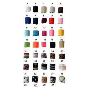 Puede incluir: Un gr&aacute;fico que muestra 39 cubiertas de llavero diferentes. Las cubiertas est&aacute;n en una variedad de colores y patrones, incluyendo colores s&oacute;lidos, rayas e estampados de animales. El gr&aacute;fico est&aacute; etiquetado como "Seleccione su cubierta de llavero".