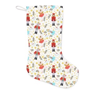 May include: A white Christmas stocking with a Nutcracker and ballerina pattern. The stocking features a repeating pattern of Nutcracker soldiers, ballerinas, stars, and holly.