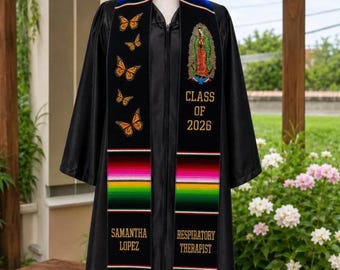 May include: A black graduation gown featuring a graduation stole with a rainbow-colored neck trim, orange butterfly embroidery, an image of Our Lady of Guadalupe, and gold text reading Class of 2026, Samantha Lopez, and Respiratory Therapist.