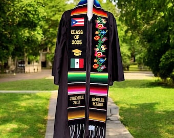 May include: Black graduation gown with a colorful graduation stole featuring the flags of Puerto Rico and Mexico, the text "Class of 2025", a graduation cap, and the names "Jeremiah 29:11" and "Amelie Marie".