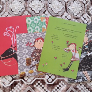 May include: Four colorful cards with illustrations and text. The cards feature a red reindeer, a girl with red hair, a girl with black hair, and a pattern of green and white tiles. The text on the cards reads: "Maybe we should pick a few mushrooms, said Pippa, breaking off a beautiful red toadstool." "You can't very well drink it, not as far as I know." "I suppose there's no other solution, but to eat it." "I hope it's all right."