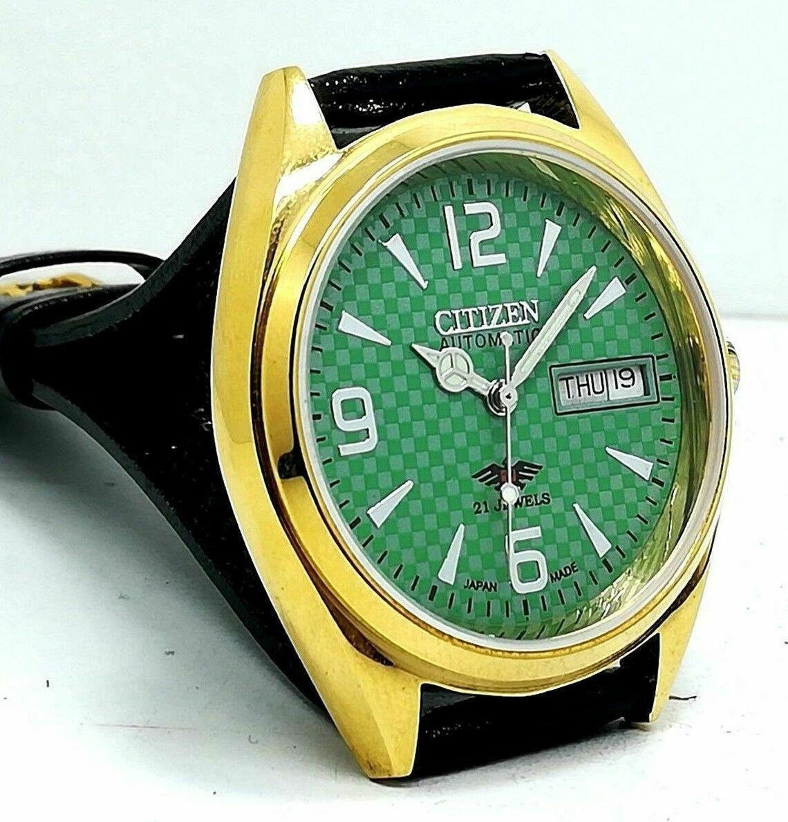 black and green citizen watch