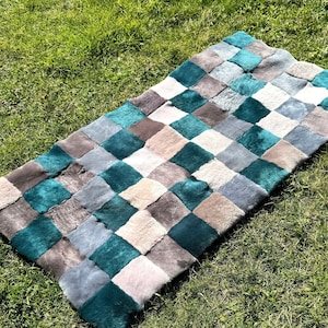 Quadratisches Muster Merinoschaffell, Merinowolle, Patchwork Schaffell, Wolldecke, echtes Schaffell, gesundes Schaffell, Wolldecke, Echtpelz