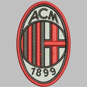 May include: Embroidered patch of the ACM Milan logo. The design features the letters "ACM" at the top, the year "1899" at the bottom, and a central emblem with red and black stripes. The patch is edged in red.