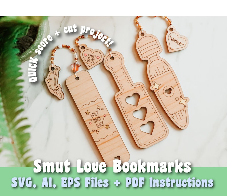 May include: Wooden bookmarks with various designs and phrases, including "Smut Slut," "Spicy," and "Whimpers." The bookmarks feature cut-out shapes, star and heart accents, and beaded chains. The text "Smut Love Bookmarks" is also visible.