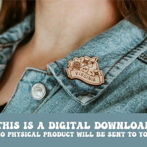 May include: A wooden pin with a cartoon bird and flowers, with the word "VIRGINIA" on a banner.