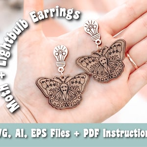 May include: A pair of wooden earrings featuring a moth design with intricate details and a lightbulb charm. The earrings are held in a hand, with the text "Moth + Lightbulb Earrings" and "SVG, AI, EPS Files + PDF Instructions" visible below.