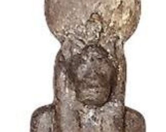 May include: A dark brown stone statue of an Egyptian god holding a staff. The god is wearing a headdress and a long robe. The statue is standing on a rectangular base.