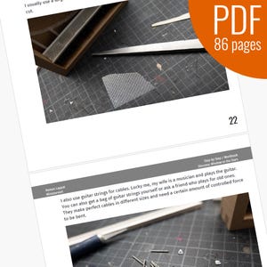 May include: Close-up of a silver guitar string, a tool, and a piece of mesh fabric. The text "Step by Step/Workbook Diorama: Window to the Stars" is visible in the background.