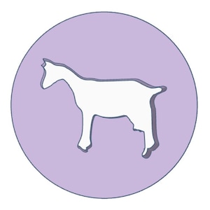 May include: A white goat silhouette inside a light purple circle with a dark purple outline. The goat is facing left, with its head up and tail down. The image has a simple, clean design.