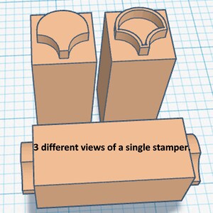 May include: Three different views of a wooden stamper with a unique design. The stamper is a light brown color and has a raised design on the top.