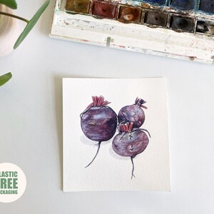 May include: Watercolour painting of three beetroot with green stems and red tops on a white background.