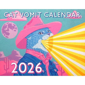 May include: A whimsical calendar cover featuring a blue cat wearing a pink cowboy hat and scarf, with a yellow beam emanating from its mouth. The text "CAT VOMIT CALENDAR" and "2026" are displayed in white. The background includes a pink moon, clouds, and desert scenery.