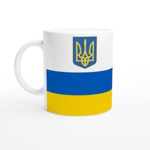 Drapeau national de l'Ukraine imprimé sur une tasse à café en céramique blanche de 11 oz. Impressions patriotiques - carte, emblème et drapeau de l'Ukraine. Va au lave-vaisselle.