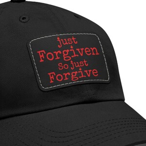 May include: Black baseball cap with a red embroidered patch that says "just forgiven so just forgive"