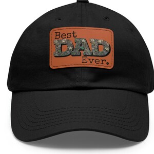 May include: Black baseball cap with a brown patch that says "Best Dad Ever." The patch has a camouflage pattern.
