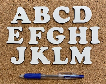 Individual wooden letters in different colors and sizes