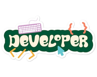 May include: A green sticker with the word "DEVELOPER" in white letters. The sticker has a keyboard, a mouse cursor, and curly brackets in different colors.