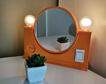 Espejo de maquillaje vintage "Elma" de plástico naranja con luz - Yugoslavia, década de 1970
