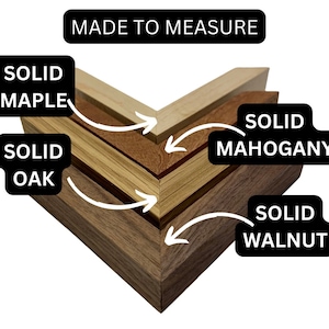 May include: Close-up of a wooden frame made to measure, showing the different layers of wood: solid walnut, solid mahogany, solid oak, and solid maple. MADE TO MEASURE is written at the top.