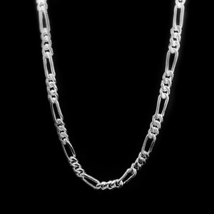 May include: A silver chain necklace with a figaro link pattern.