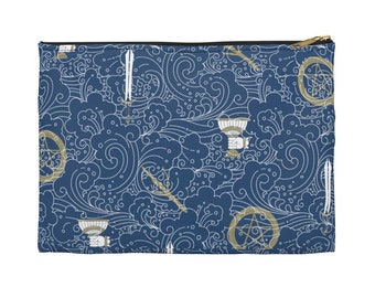 May include: A rectangular navy blue zippered pouch with a repeating pattern of white waves and gold-colored occult symbols. The symbols include swords, chalices, tridents, and pentagrams. The zipper is gold-colored.