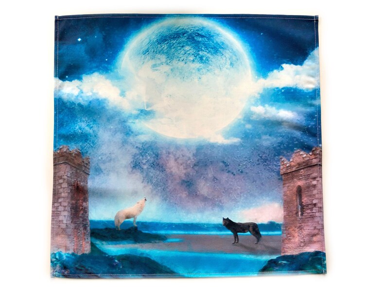 May include: A blue and purple watercolor-style illustration of a full moon with two wolves howling at each other. The wolves are silhouetted against a blue and purple sky with clouds. The moon is large and bright, and the wolves are facing each other. The scene is set in front of two stone towers.
