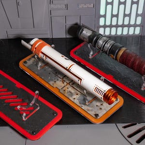 Stone Series Lightsaber Stand, featuring real stone and cast acrylic. Perfect displays for canon and custom hilts.