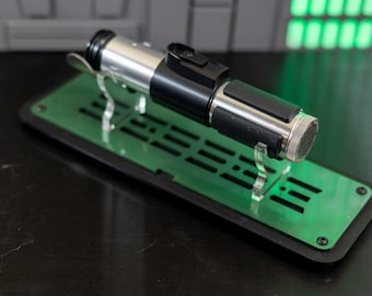 The Master, a small Lightsaber Stand.  Designed for this saber. Made from Cast Acrylic optional Wall mount. Do or do not. There is no try