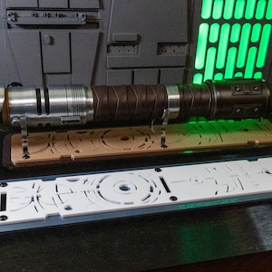 Cal Inspired Long Staff Edition Lightsaber Flat Stand made from Beautiful Cast Acrylic. A great gift for that lightsaber lover.