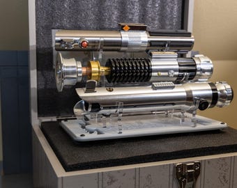 Exclusive 2024 triple Lightsaber Box Set Inspired Stand. Designed for this saber set.  Made from Beautiful Seamless Laser Cut Cast Acrylic