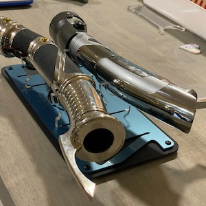 C.D. Legacy Lightsabers Stand made with cast acrylic sheets that are laser cut.