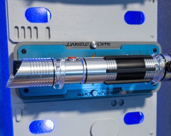 Your Favorite Cruiser Wall mounted LightSaber Stand. Celebrate your trip with this wall mounted stand made out of laser Cut Cast Acrylic.