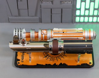 L& L. Legacy Lightsaber Inspired Stand. Custom designed for this saber set, can hold most lightsabers. Made from beautiful cast Acrylic.
