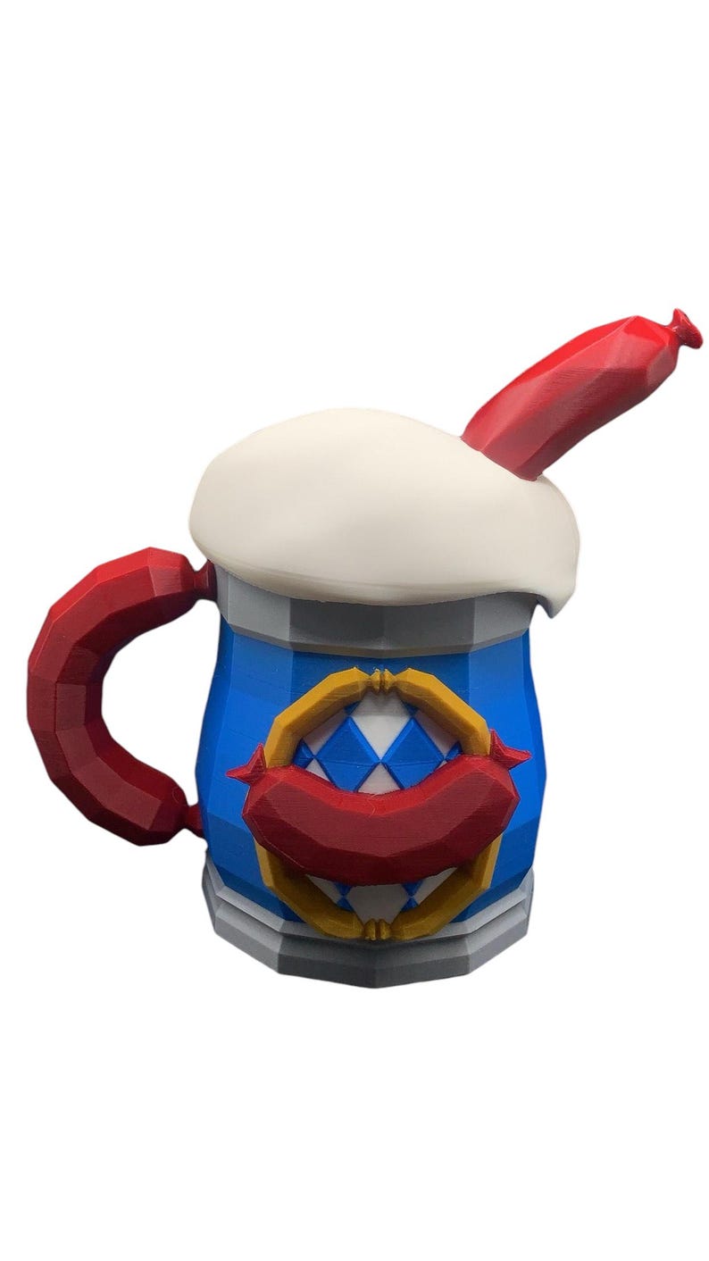 May include: A low-poly 3D printed beer mug featuring a blue and white diamond pattern, a white foam top, and a red sausage handle. A red sausage is also attached to the front emblem, and another red sausage protrudes from the top of the foam.