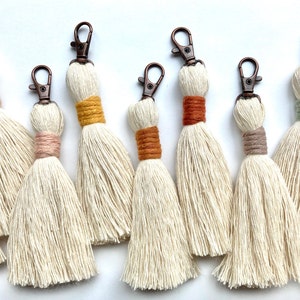 Cream colored tassel zipper pulls/keychains with colorful accent